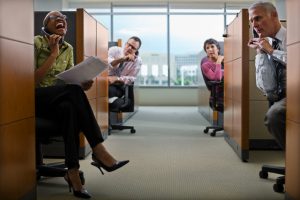 Businesspeople Irritated by Loud Cowork in Cubicle --- Image by © Tim Pannell/Corbis